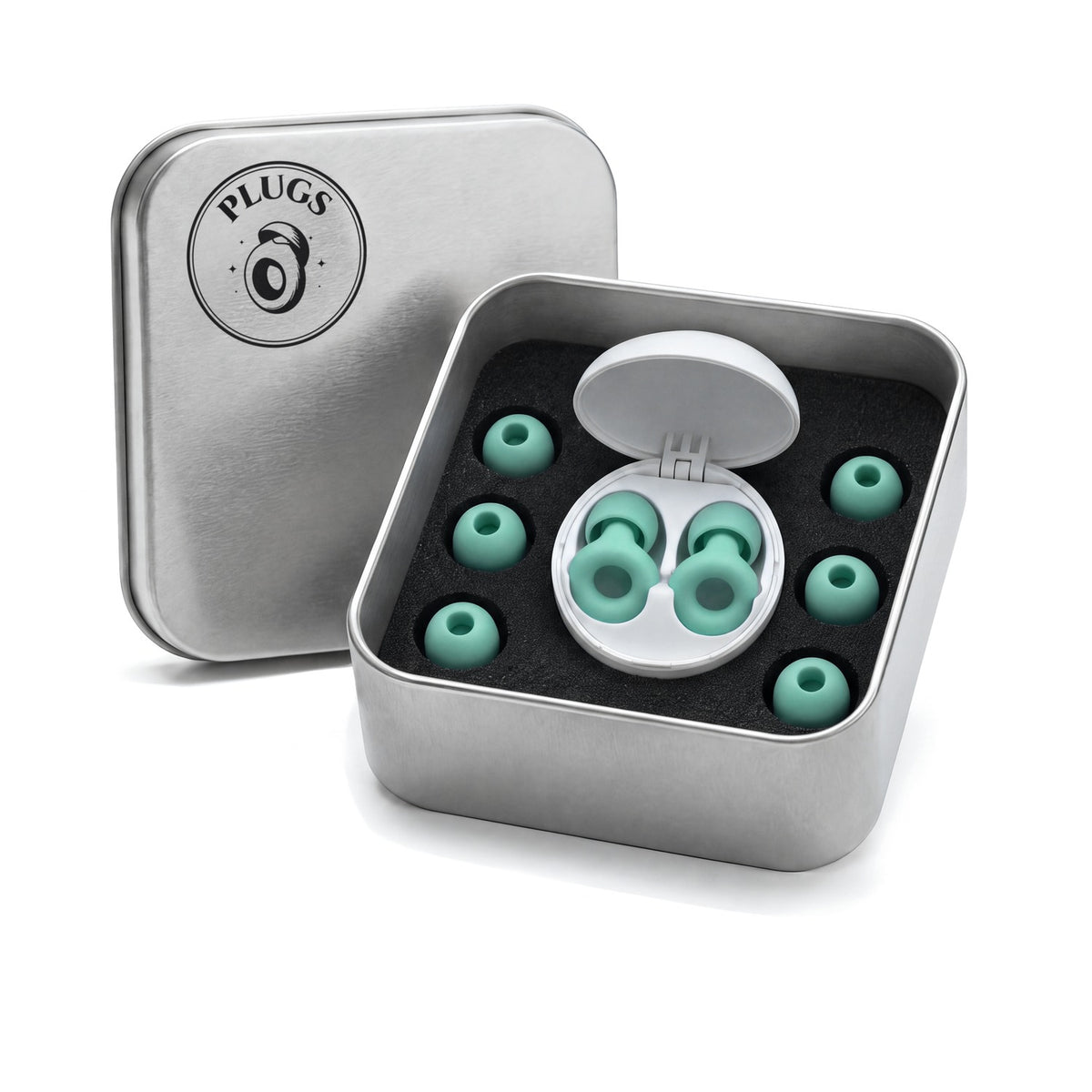 The open PLUGS steel gift tin: Mint earplugs in their white carry case, with three spare tip pairs on a black foam floor