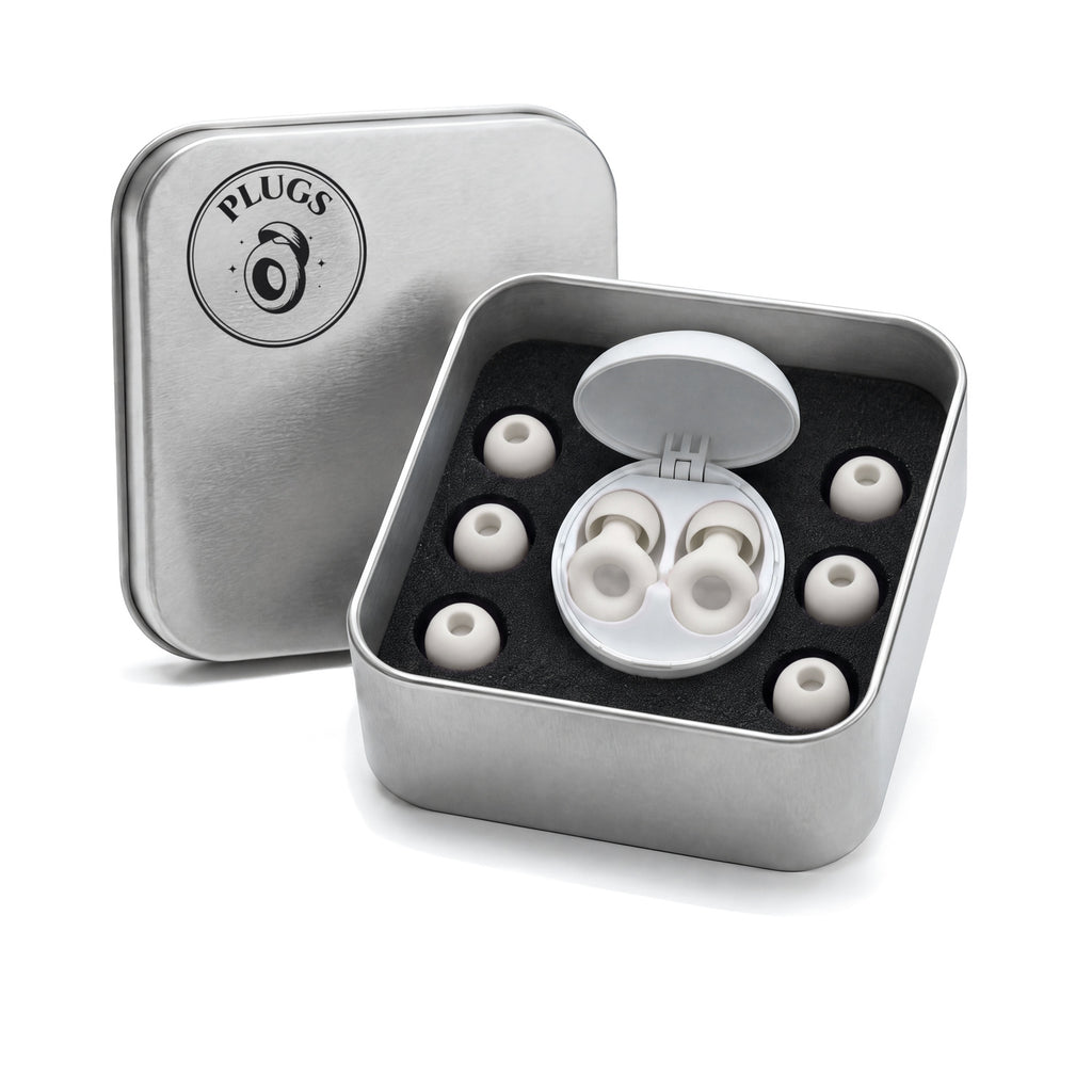 Open steel PLUGS tin with the White pair in its round white carry case and three spare pairs of ear tips around it